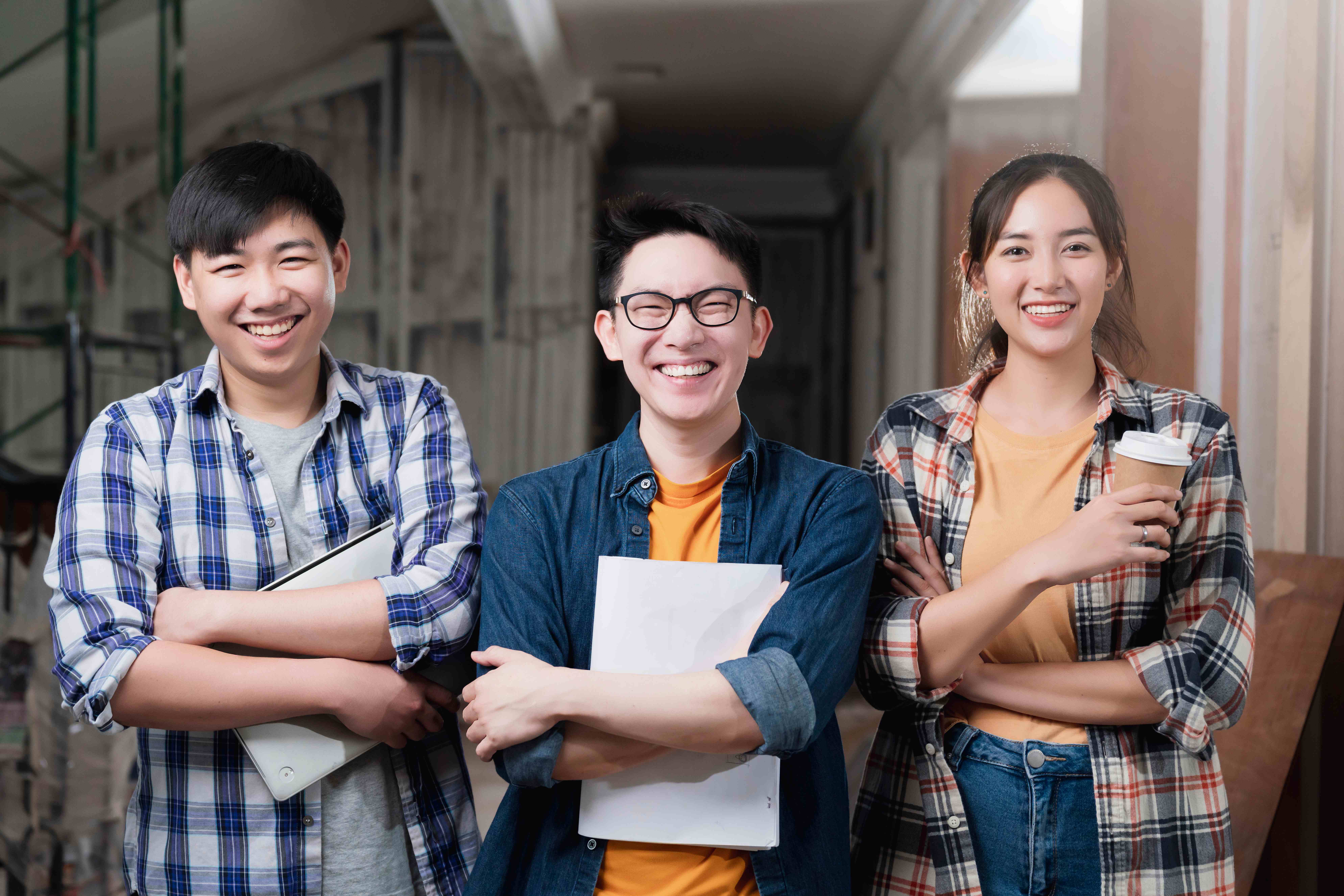 Cheerful students celebrating outdoors