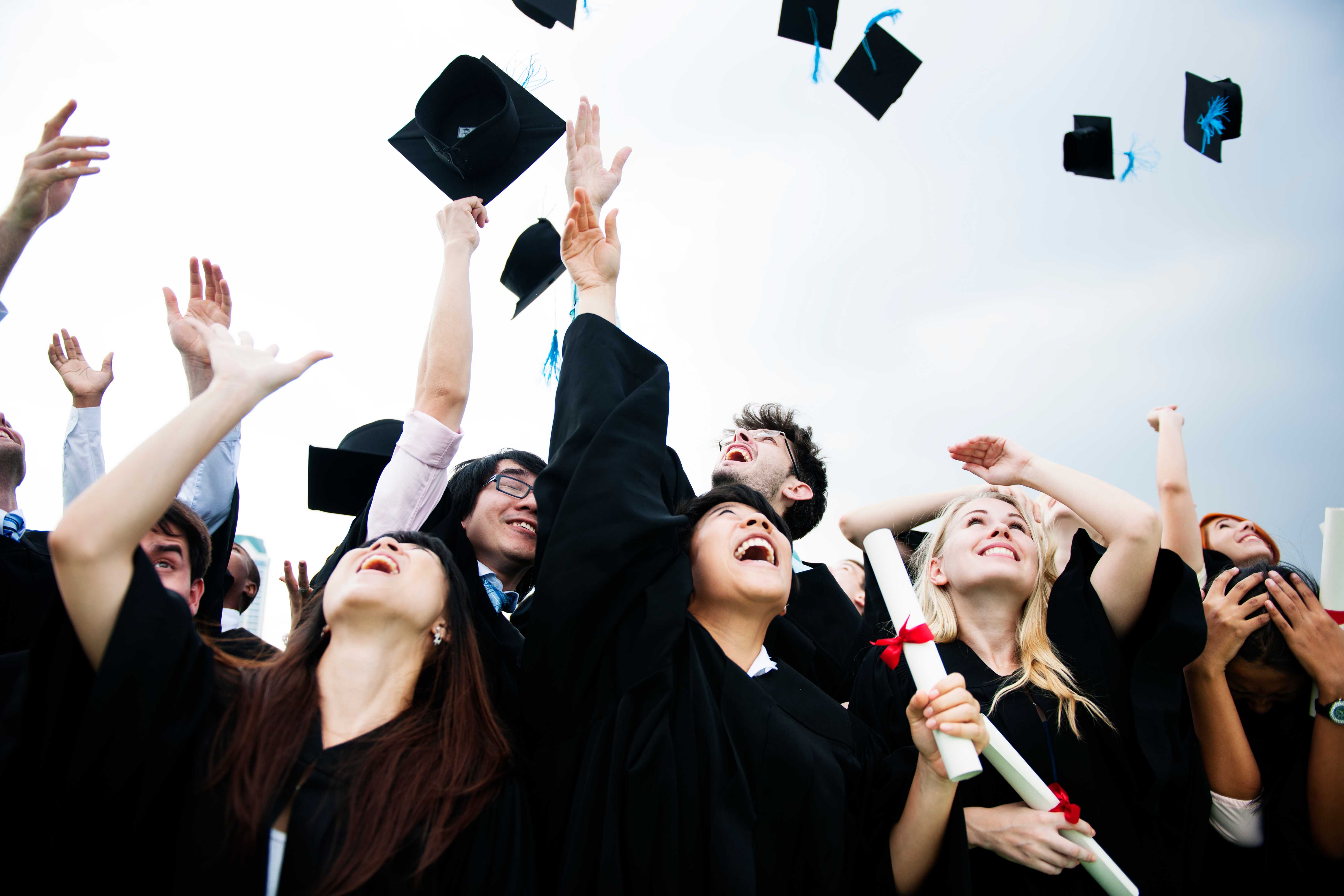Diverse graduates celebrating